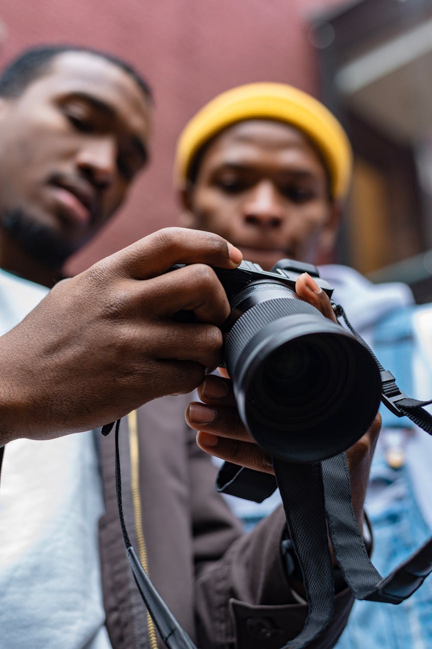photographer showing the model the picture that he took of him. one sentence review